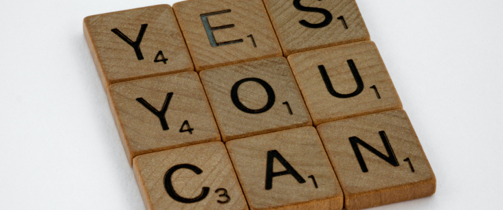 Spielsteine mit dem Text "Yes you can"